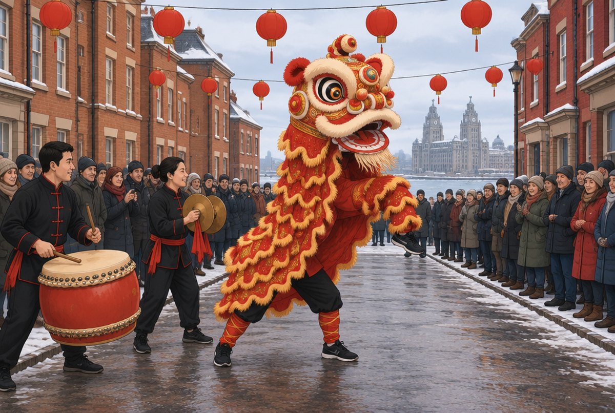 A red and gold lion dance in a Liverpool street with drummers and a watching crowd.